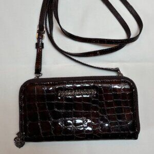 Brighton brown clutch purse with adjustable and removable strap.